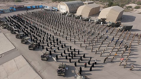 This handout photo released by Iran's Revolutionary Guards Corps (IRGC)'s official website Sepanews on February 16, 2026, shows members of the IRGC and navy taking part in a military exercise in the Gulf.