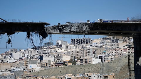 A bridge struck by US airstrikes on Thursday is seen in the town of Karaj, west of Tehran, Iran, Friday, April 3, 2026.