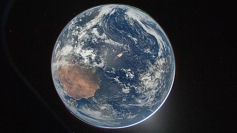 This image provided by NASA shows a view of Earth taken by NASA astronaut and Artemis II commander Reid Wiseman from the Orion spacecraft's window after completing the translunar injection burn on April 2, 2026. 