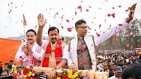 In this photo from Mar 30, 2026, BJP President Nitin Nabin (C) campaigns in support of BJP Assam State President Dilip Saikia (L) and Assam Minister Pijush Hazarika (R) during an election rally at Jagirod, in Morigaon.