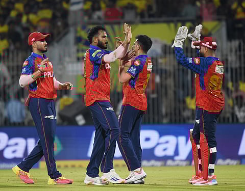 Vyshak Vijaykumar celebrates a wicket with teammates