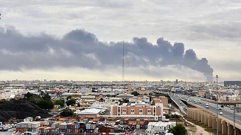 Smoke rises from Kuwait International Airport after a drone strike on fuel storage in Kuwait City, Kuwait, March 25, 2026.