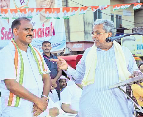 Karnataka CM Siddaramaiah with UDF candidate AKM Ashraf at an election rally in Manjeshwar assembly constituency of Kasaragod, Kerala on Sunday