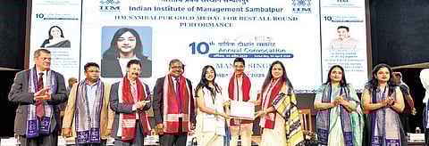 Governor Hari Babu Kambhampati awarding the IIM Sambalpur Gold Medal to Manya Singh for best all-round performance during the convocation 