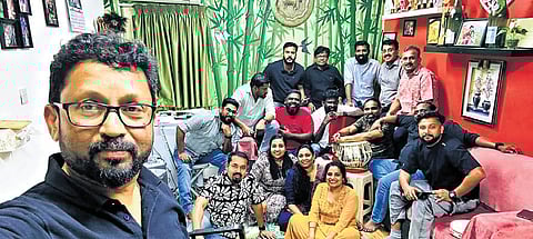 Members of Kala Kuwait behind the viral parody; lyricist Shebin (in a black T-shirt, seated at the right corner) and lead singer Sandeep (in a red T-shirt). 