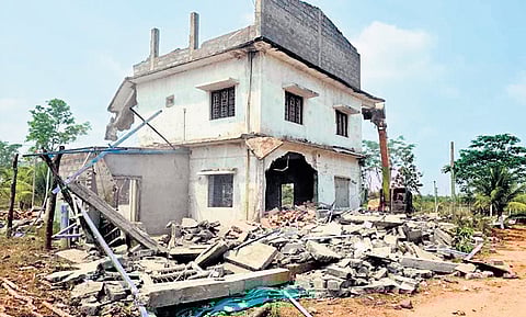 An illegally-constructed house demolished by the district administration