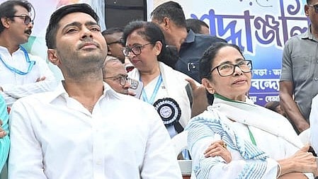 Bengal Chief Minister Mamata Banerjee (R) with senior TMC leader Abhishek Banerjee.