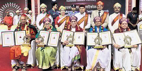 Governor Thaawarchand Gehlot and MP Dr C N Manjunath with DLitt awardees Bhikkhu Ananda Thero, Pushpa Dixit, Vyasanakere Prabhanjanacharya, Nirmalanandanatha Swamiji and Sukant Kumar Senapati during the convocation of Karnataka Samskrit University at in Bengaluru on Tuesday 