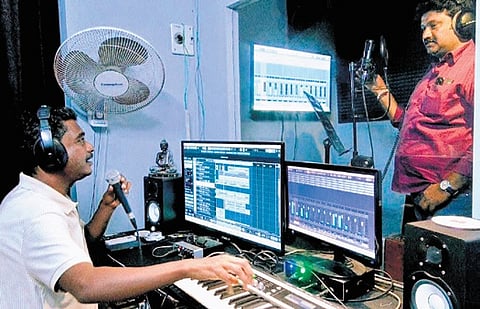 A Pudukkottai-based composer putting together a campaign song.
