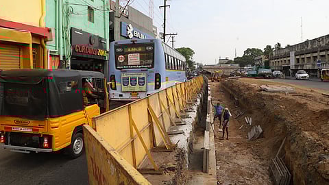 vehicles ply on the small way left for vehicles near the Saibaba Colony flyover ramp.