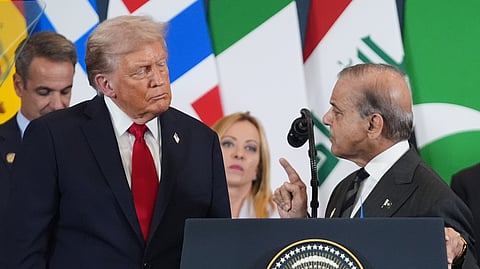 President Donald Trump, left, listens as Pakistan's Prime Minister Shehbaz Sharif speaks during a summit to support ending the more than two-year Israel-Hamas war in Gaza after a breakthrough ceasefire deal on Oct. 13, 2025, in Sharm El Sheikh, Egypt.