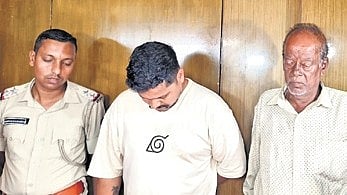 Police along with two accused Rakesh Rout and Golekh Chandra Sathua.