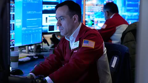 Robert Greason works on the floor at the New York Stock Exchange in New York, Tuesday, April 7, 2026.