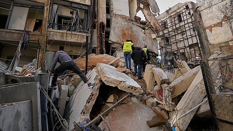 People inspect the rubble of a building destroyed in an Israeli airstrike a day earlier in Beirut, Lebanon, Thursday, April 9, 2026.
