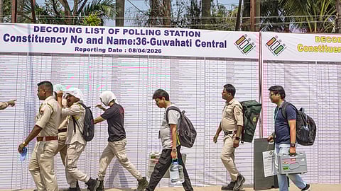  Polling officials after collecting election materials from a distribution centre, leave for their respective booths on the eve of voting in the Assam Assembly elections, in Guwahati, Wednesday, April 8, 2026
