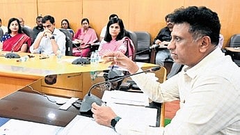 Minister MC Sudhakar launches the logo  for the Career 2 Campus Summit on Wednesday.