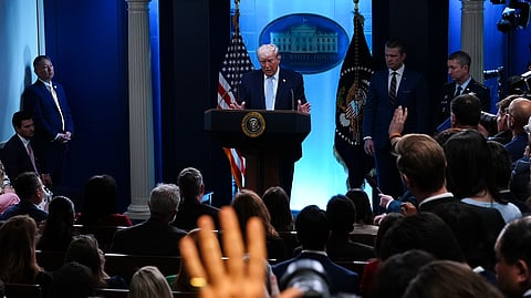 President Donald Trump, accompanied by Defense Secretary Pete Hegseth and Chairman of the Joint Chiefs of Staff Gen. Dan Caine, speaks with reporters in the James Brady Press Briefing Room at the White House, Monday, April 6, 2026, in Washington.