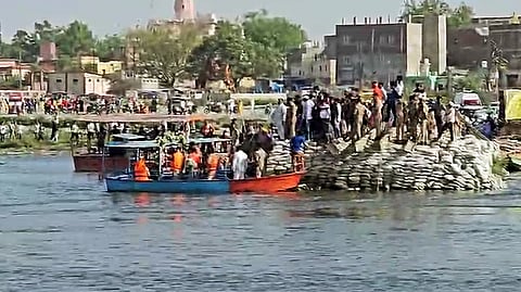 Police personnel at the spot where a boat accident occurred on the Yamuna River near Keshi Ghat in Mathura on Friday. 