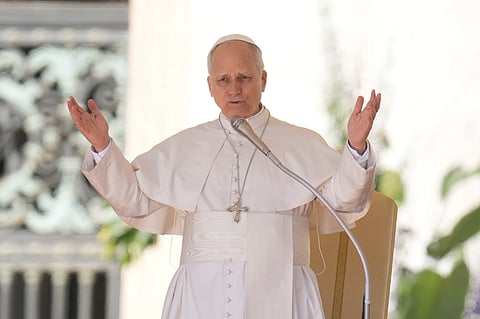 Pope Leo XIV blesses faithful as he starts his weekly general audience in St. Peter's Square, at the Vatican, Wednesday, April 8, 2026.