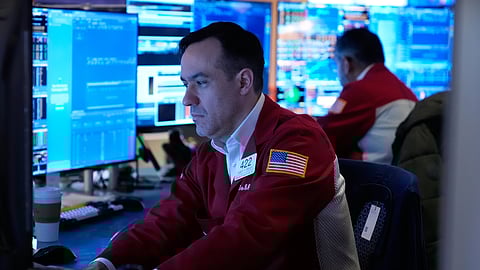 Robert Greason works on the floor at the New York Stock Exchange in New York, Tuesday, April 7, 2026. 