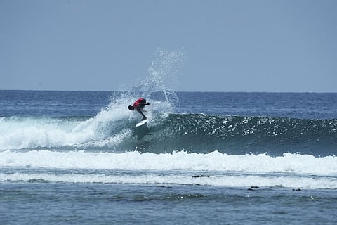 Surfers in action at the iconic Buttler Bay beach