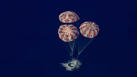 In this image from video provided by NASA, the Artemis II Orion capsule splashes down in the Pacific Ocean, on Friday, April 10, 2026.