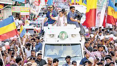 AIADMK general secretary Edappadi K Palaniswami waving to the massive crowd of cadre and people surrounding him during his visit to Kancheepuram as part of his poll campaign on Friday.