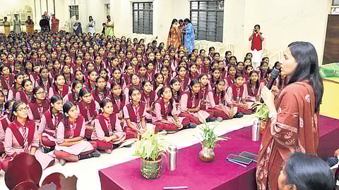 Collector P Pravinya addresses students of Mahatma Jyotiba Phule BC Girls’ Residential School and College in Muttangi, Sangareddy district