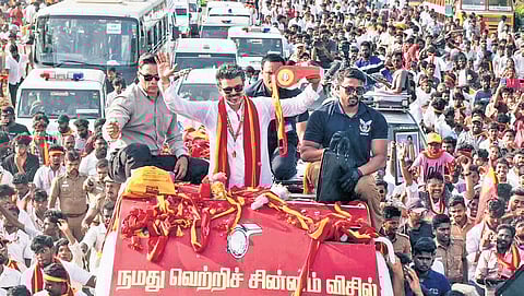 Actor-politician Vijay waving at supporters during a rally in Kanniyakumari.