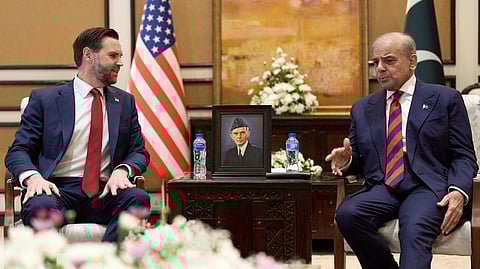 Pakistan's Prime Minister Shehbaz Sharif (R) speaks with US Vice President JD Vance during their meeting amid the US-Iran peace talks in Islamabad on April 11, 2026.