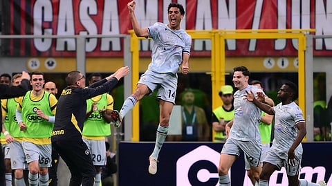 Udinese's French midfielder #14 Arthur Atta celebrates after scoring a goal during the Italian Serie A football match between AC Milan and Udinese at the San Siro stadium in Milan, northern Italy, on April 11, 2026.