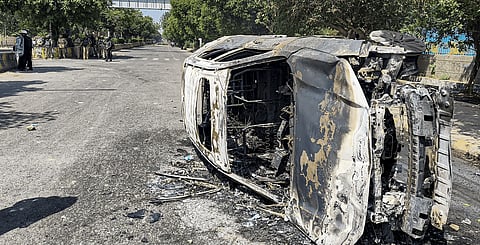 Violence erupted during a factory workers’ protest demanding wage hike in Noida’s Phase-2 and Sector 60 areas on Monday, with incidents of arson, vandalism and stone-pelting reported. Security forces were deployed as vehicles were torched and damaged, leaving wreckage across the protest site.