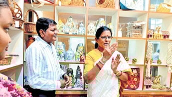 Deputy CM Pravati Parida interacts with shareholders during her visit to the Annapurna Gramina Bazar on Monday