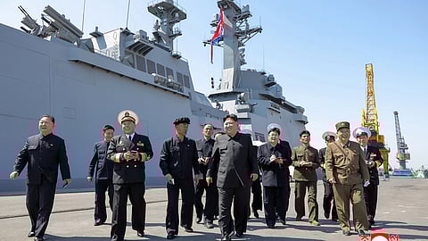 In this photo provided by the North Korean government, its leader Kim Jong Un, center, visits to observe the test launches of missiles at an undisclosed place in North Korea Sunday, April 12, 2026.