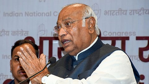 Congress President Mallikarjun Kharge speaks during a press conference at the party headquarters in New Delhi.