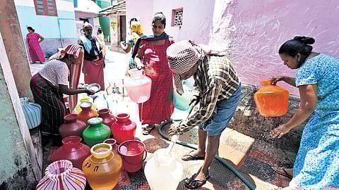 Women queuing up to collect water at Kottappuram in Vizhinjam