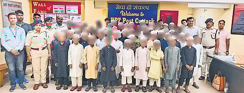 RPF personnel along with the 59 boys rescued from Cuttack railway station | Express