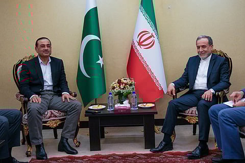 In this photo released by the Iranian Foreign Ministry, Iranian Foreign Minister Abbas Araghchi, right, meets with Pakistan's Army Chief Field Marshal Gen. Asim Munir in Tehran, Wednesday, April 15, 2026. 