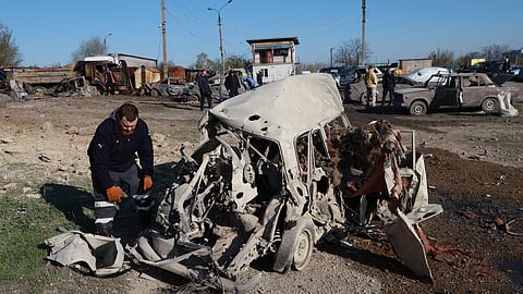 Cars damaged by Russia's drone attack are seen in Zaporizhzhia, Ukraine, Wednesday, April 15, 2026.