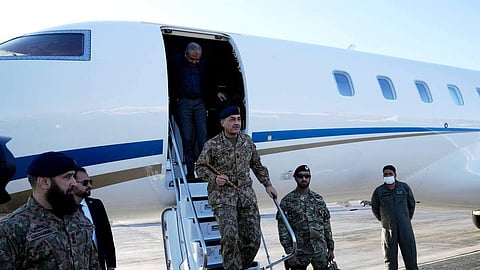 In this photo released by Telegram channel of the Iranian Foreign Minister Abbas Araghchi, Pakistan's Army Chief Field Marshal Gen. Asim Munir steps off the plane upon his arrival in Tehran, Iran, Wednesday, April 15, 2026.