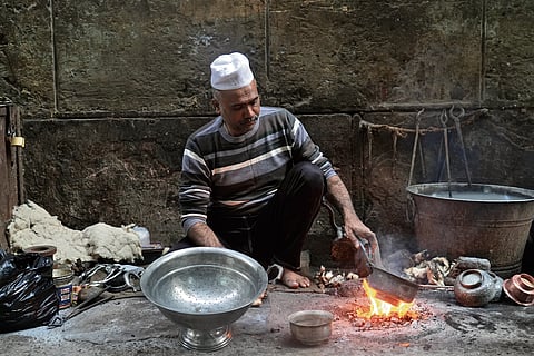 Nayeem at his workstation on the roadside