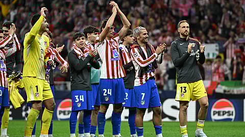 Atletico Madrid's Antoine Griezmann (2R) and teammates celebrate after winning the UEFA Champions League quarter final second leg football match between Club Atletico de Madrid and FC Barcelona on April 14, 2026.
