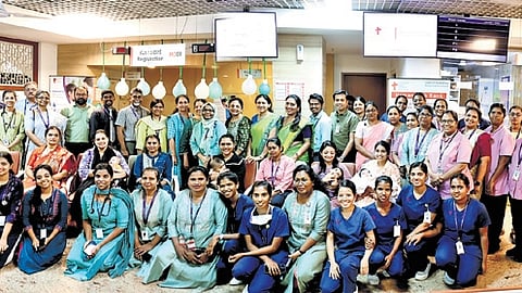 Baptist hospital staff pose for a photo during the first anniversary celebration of its Human Milk Bank in Bengaluru on Saturday