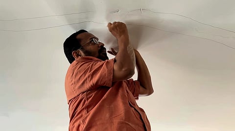 Revenue Minister K Rajan inspecting a house at the township in Kalpetta.