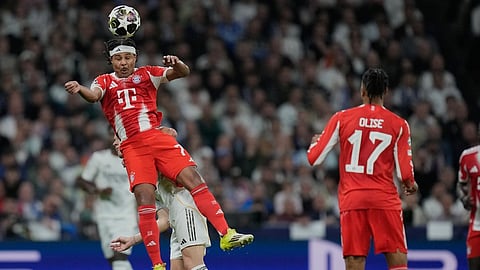 Bayern's Serge Gnabry heads the ball during the Champions League quarterfinal first leg soccer match between Real Madrid and Bayern Munich in Madrid, Spain, Tuesday, April 7, 2026.