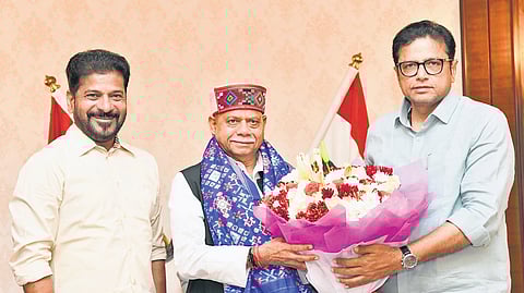 Chief Minister A Revanth Reddy and IT & Industries Minister D Sridhar Babu greet Governor Shiv Pratap Shukla at Lok Bhavan in Hyderabad on Sunday