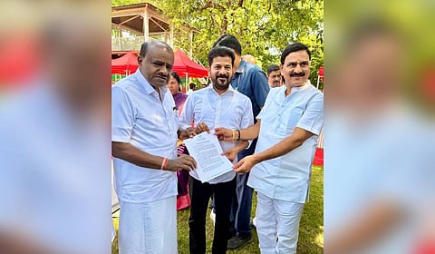 Chief Minister A Revanth Reddy submits a memorandum to HD Kumaraswamy in New Delhi on Saturday.