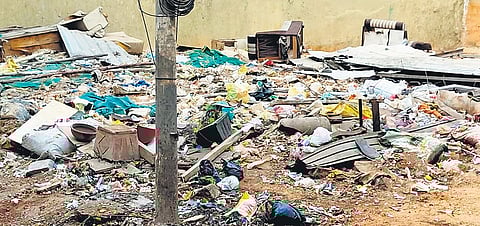 Garbage dumped on a vacant plot on Mackan Road in Shivajinagar
