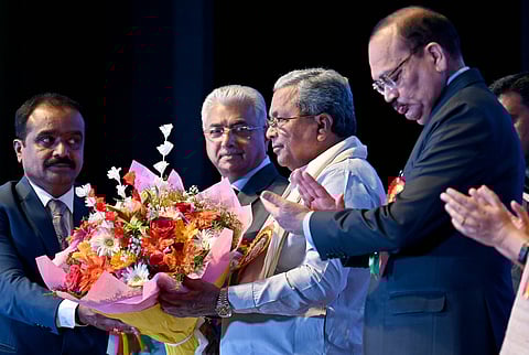 Chief Justice of India justice Surya Kant with Chief Minister Siddaramaiah during the 22nd Biennial State Level Conference of Judicial Officers on "Reimagining the Judiciary in the Era of Artificial Intelligence" in Bengaluru on Saturday. 