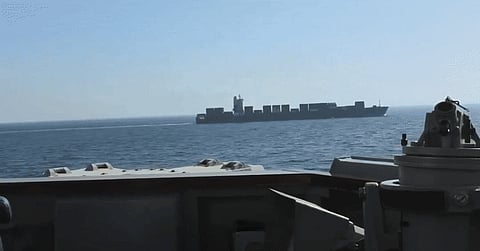U.S. Central Command footage shows American forces warning the Iranian-flagged vessel Touska to evacuate its engine room before firing disabling rounds and boarding the ship in the Gulf of Oman after it allegedly ignored repeated orders.